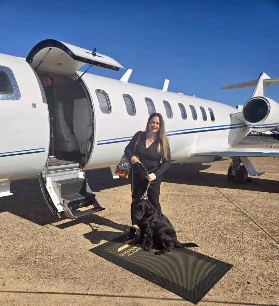 Kelly accompanying a dog in-cabin on a private flight